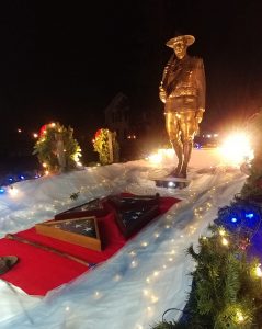 The Statue, veteran's flags and personal items on the red carpet adorn the Co F float